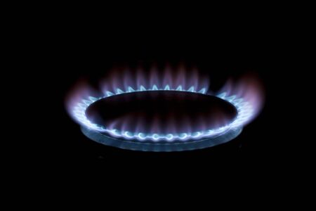 A burning gas hob glowing in the darkの写真素材