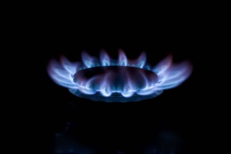 A gas hob from a cooker burning in the darkの写真素材