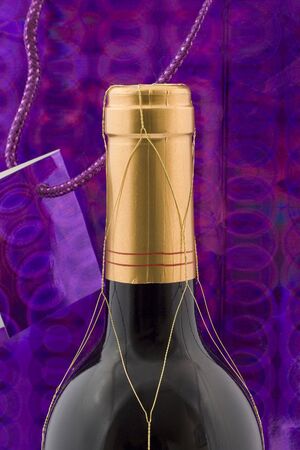 A wine bottle with gift wrapping and tagの写真素材