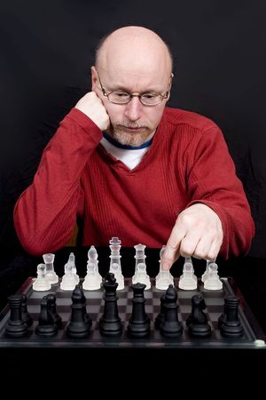 A man thinking about his opening chess moveの写真素材