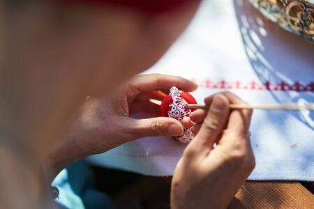 Workshop of decorating easter eggs  in beautiful hungarian village Holloko, Hungary