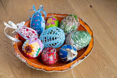 Easter eggs in a orange bowl â decoration of a holiday table during celebrationの写真素材