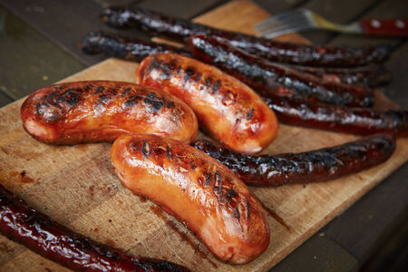 closeup of prepared on grill different sausagesの写真素材