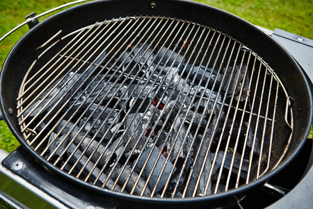 closeup of charcoal in grill with grateの写真素材
