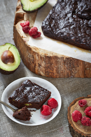 a chocolate pie on a piece of parchment on the woodの写真素材