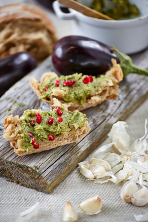 two rustic open sandwiches on the wooden boardの写真素材