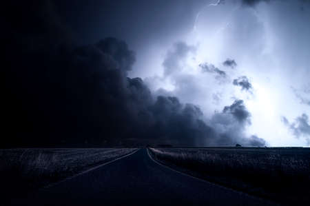 Brightening view of a massive storm with visible lightning, and large storm clouds