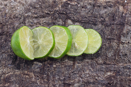 lime isolated on  Wooden backgroundの写真素材
