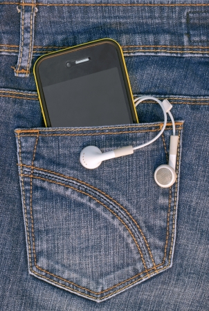 A mobile phone in the pocket of denim trousers の写真素材