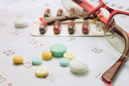 pill bottle pouring on background