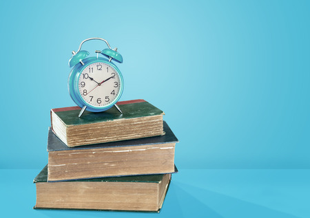 Clock placed on booksの写真素材