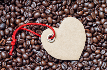 Labels heart on coffee beanの写真素材