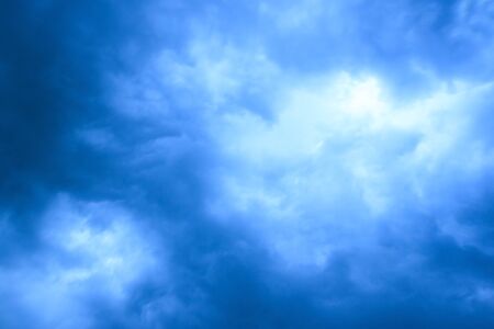 White Cloud and Black Storm Cloud On Skyの写真素材