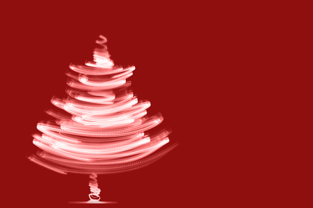 Christmas background with Christmas tree from lights.の写真素材