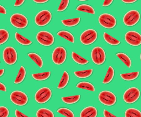 Watermelon pattern made of sliced watermelon on green background. Flat lay, top view.の写真素材