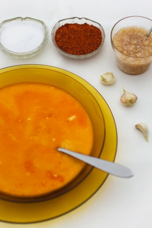 A plate of delicious soup, salt and pepperの写真素材