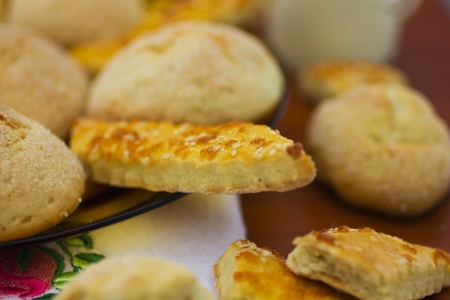 Delicious fresh baked cookies in plate and on tableの写真素材