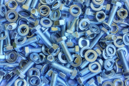Metal background - pile of metal componentsの写真素材