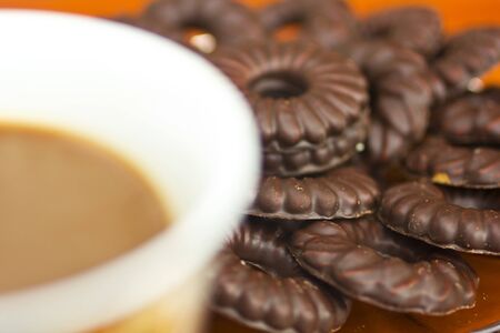 Coffee cup and chocolate biscuitsの写真素材