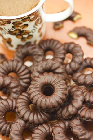Coffee cup and chocolate biscuitsの写真素材