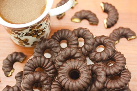 Coffee cup and chocolate biscuitsの写真素材