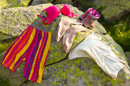 Ladies clothes on rocksの写真素材