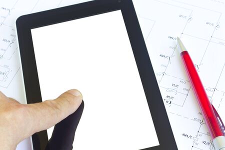 Man working with tablet computer over engineering diagramの写真素材