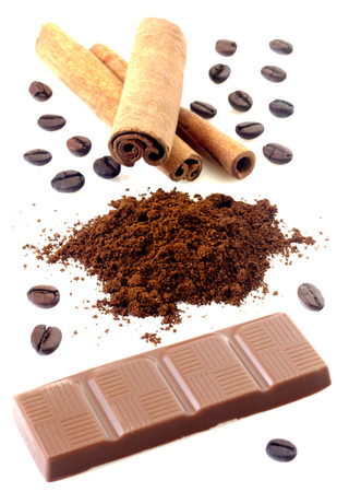 Cinnamon with chocolate and coffee beans isolatedの写真素材