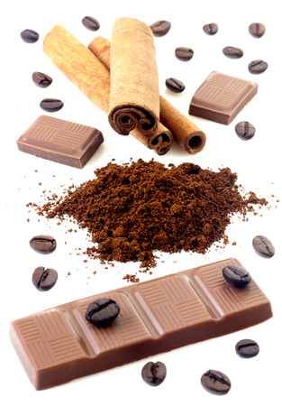 Cinnamon with chocolate and coffee beans isolatedの写真素材