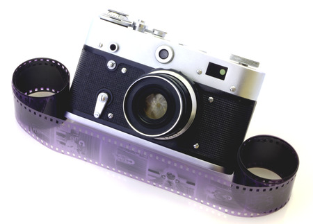 Retro camera and tape isolated on whiteの写真素材