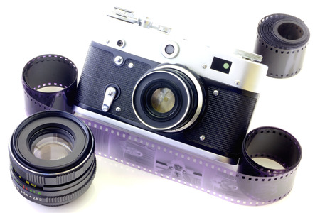 Retro camera and tape isolated on white