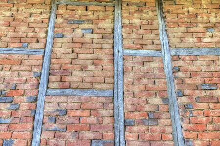 Stylish brick wall with wooden beamsの写真素材