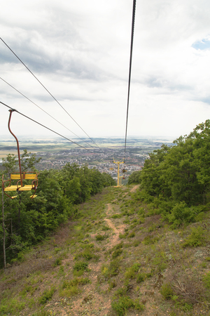 Chairlift in the summer mountainの写真素材