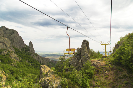 Chairlift in the summer mountainの写真素材
