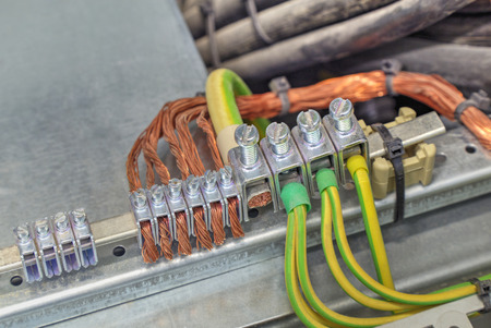 Grounding terminals and wires in industrial electrical control cubicleの写真素材