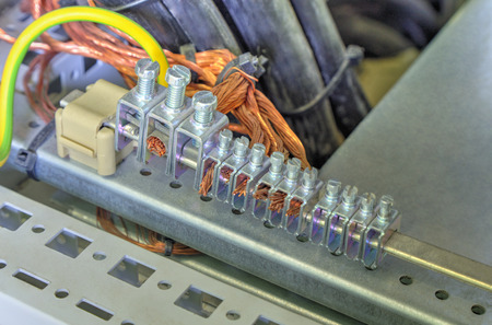 Grounding terminals and wires in industrial electrical control cubicleの写真素材