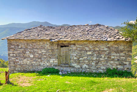 Old stone house in the mountainの写真素材