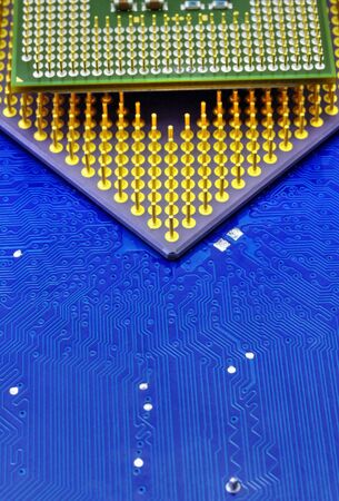 Technological background with computer motherboard and central processing units closeup