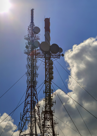 Communication antenna towers on blue sky