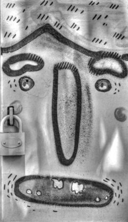 Funny metal boxes painted with human faces on them in black and white