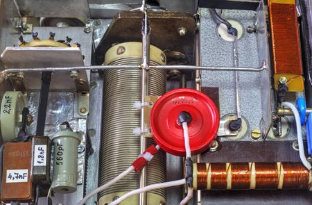 Inside view of high frequency power amplifier with capacitors, coils and other componentsの写真素材