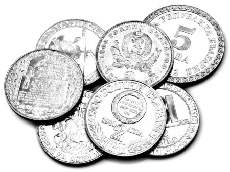 A pile of anniversary coins of the Republic of Bulgaria isolated on white background in black and whiteの写真素材