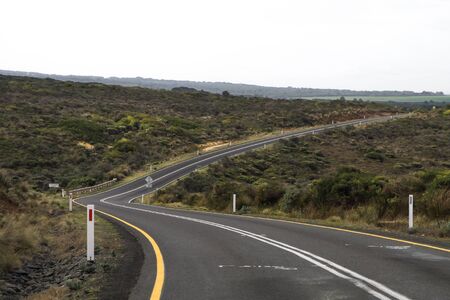 A turning asphalt road in the countrysideの写真素材