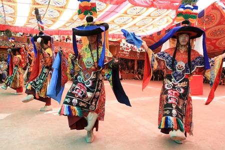 LADAKH, INDIA-JULY 29, 2012 - Unidentified buddhist monks dancing during a summer festival at Dak Thok Monastery in Ladakh, Indiaのeditorial素材