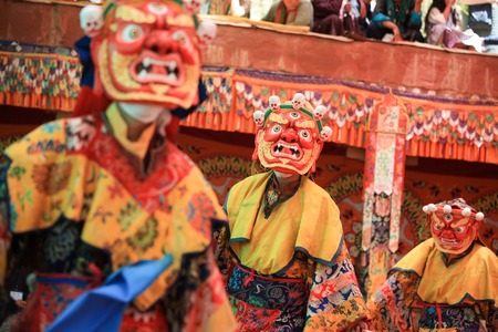 LADAKH, INDIA-JULY 29, 2012 - Unidentified buddhist monks dancing during a mask festival at Dak Thok Monastery in Ladakh, Indiaのeditorial素材
