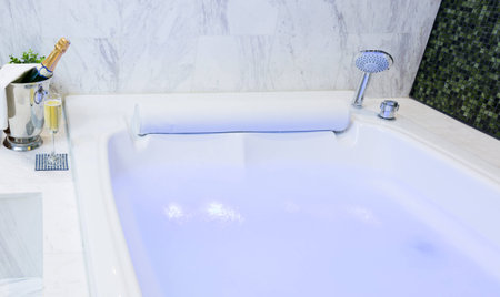 Champagne glass and whirlpool Spa with colourful light whirlpoolの写真素材