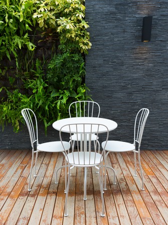 Vintage outdoor coffee table in cafe wooden terraceの写真素材