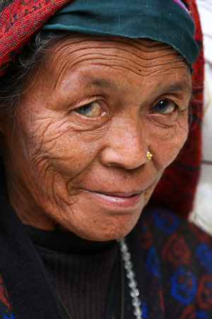 KATHMANDU, NEPAL-DECEMBER, 2009 - An unidentified nepalese woman doing their daily life duty along the street in summerのeditorial素材