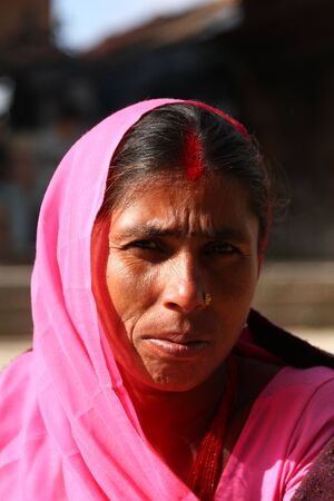 KATHMANDU, NEPAL-DECEMBER, 2009 - An unidentified nepalese woman doing their daily life duty along the street in summerのeditorial素材