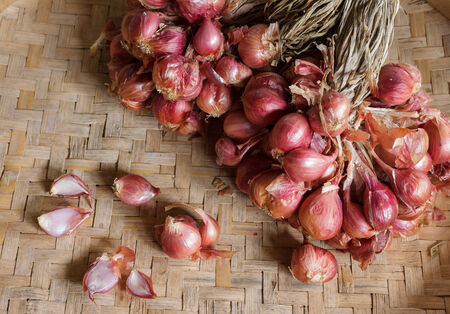 Shallot - red onion on the threshing basket